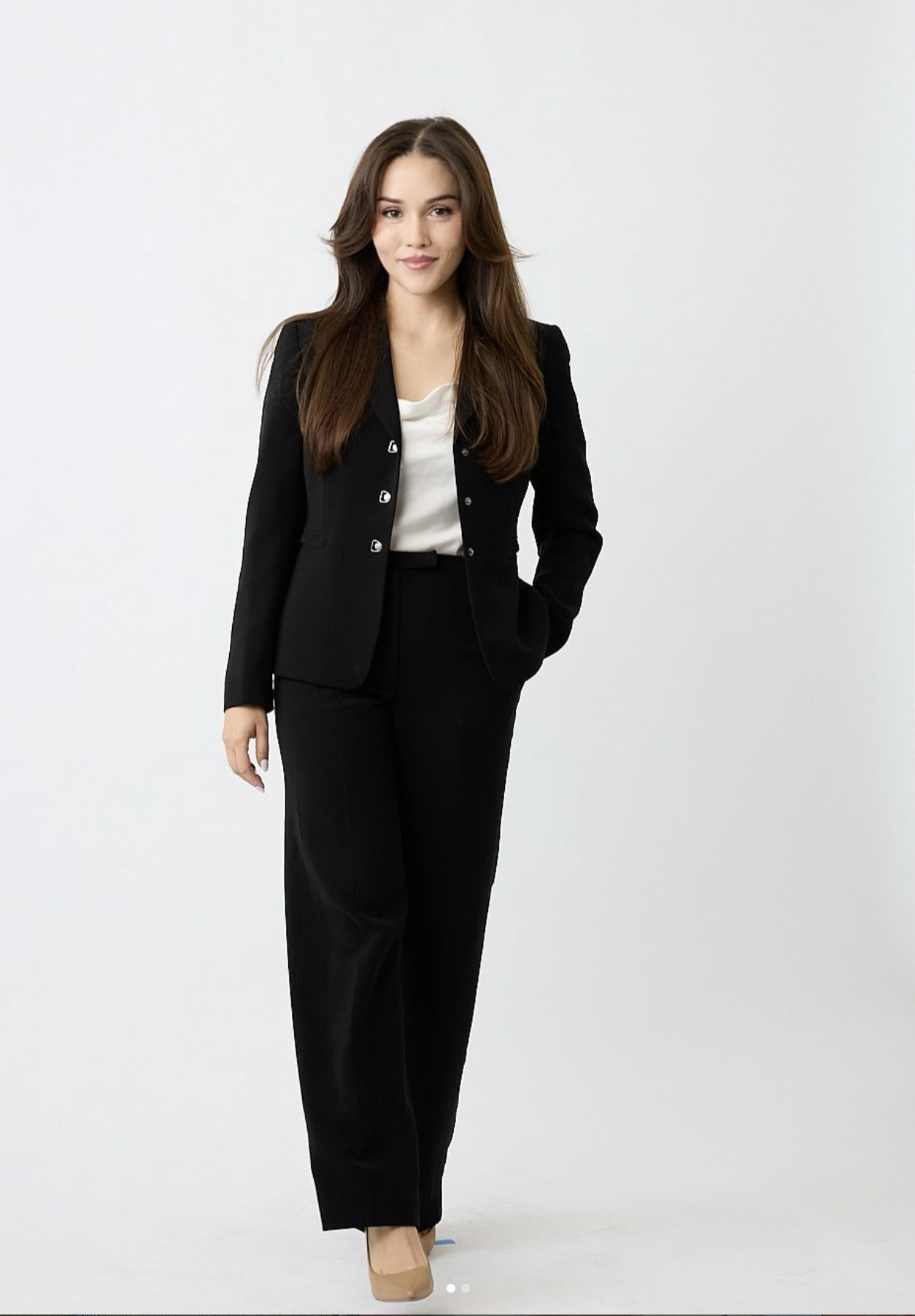 Alexa, stylist based in Los Angeles, in a tailored black suit